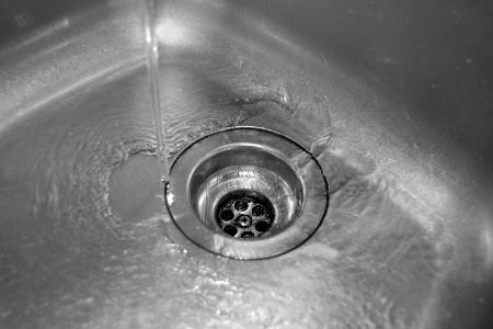 What Causes Recurring Drain Clogs in Kitchens and Bathrooms?